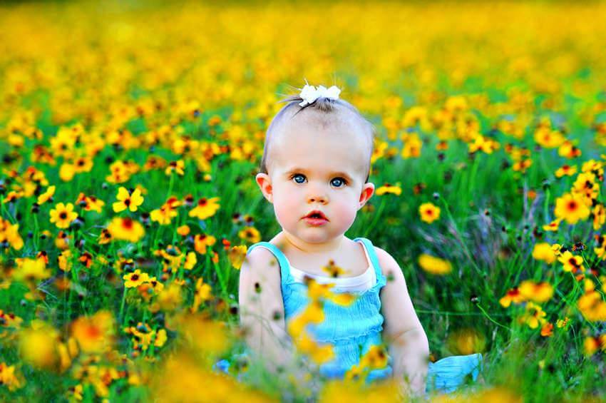beautiful baby girl with flowers